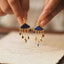 Cloud dangle earrings with colorful charms — primary view