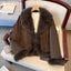 Brown cropped coat with dark plush trim, front view on a hanger