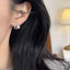 Pearl gourd stud earrings — primary view
