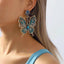 Butterfly rhinestone earrings in 18K gold-plated finish — primary view