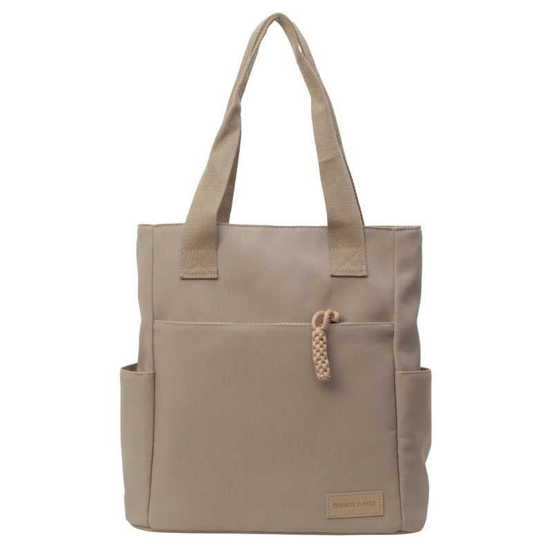 Canvas tote bag shown from side angle