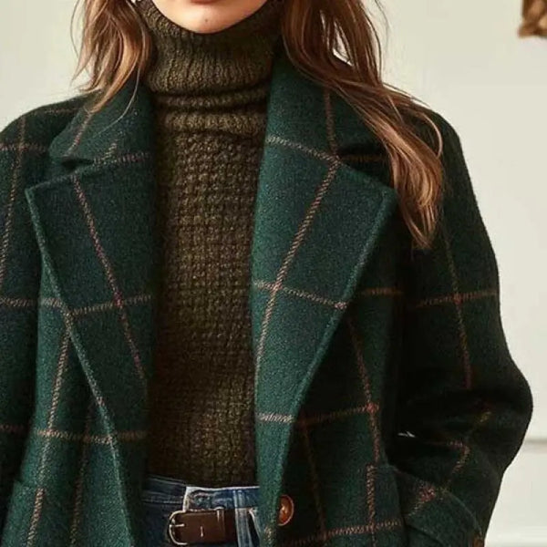 Close-up of lapels and windowpane pattern on a dark green coat