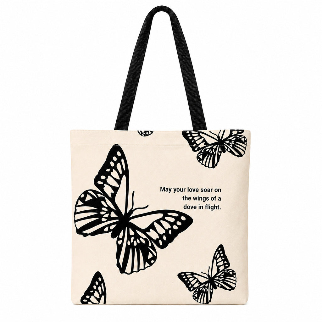 Canvas tote bag shown carried by hand