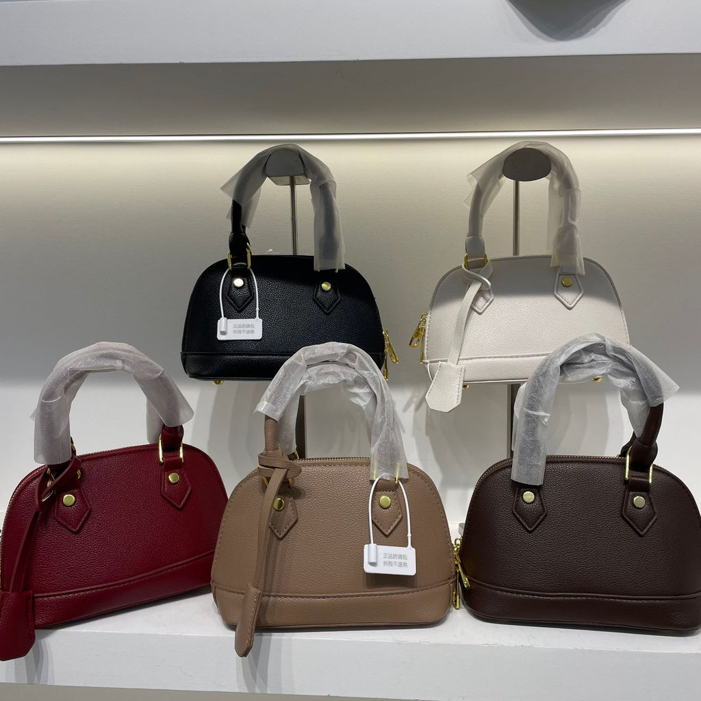 Shell crossbody bag adjustable strap detail