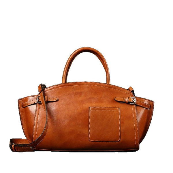 Boston bag shown carried by top handle