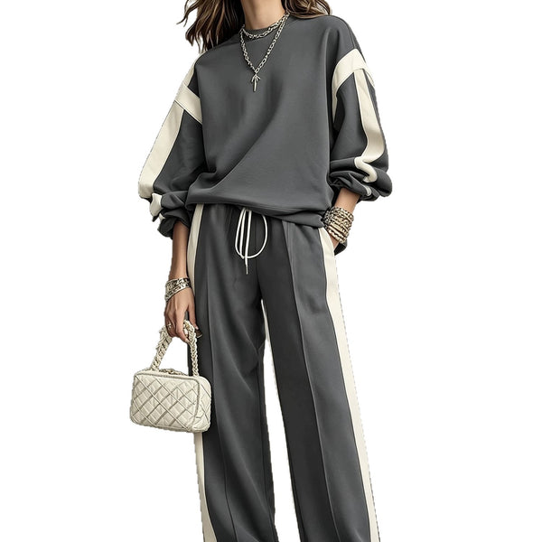 Charcoal sweatshirt and wide-leg pants set with cream contrast panels, worn by a model