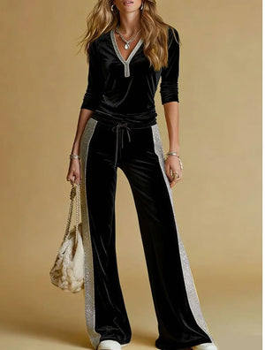 Black velvet-look top and wide-leg pants set with white side stripes