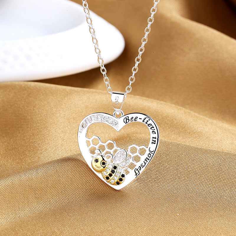 Sunflower and bee heart necklace — primary view