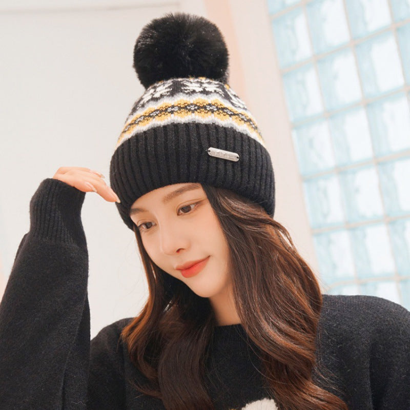 Black pom pom knit beanie with ear flaps for women