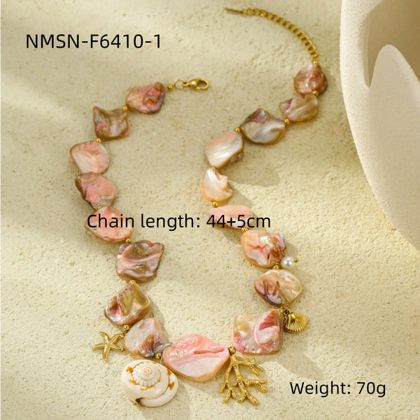 Pink shell-style necklace with gold-tone marine charms and measurement labels