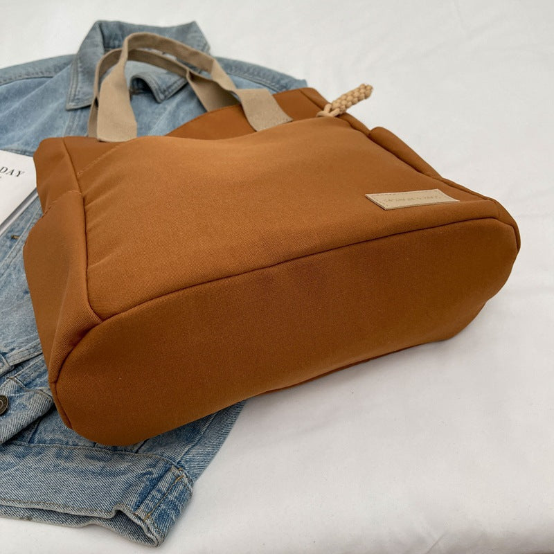 Canvas tote bag laptop compartment detail