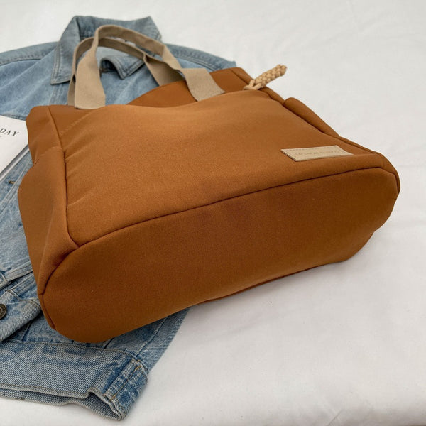 Canvas tote bag laptop compartment detail