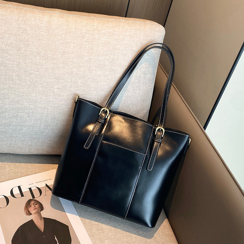 Leather tote bag shown from side angle