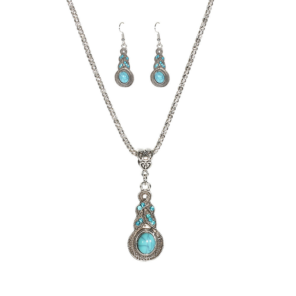 Silver-tone turquoise-colored teardrop pendant necklace with matching drop earrings