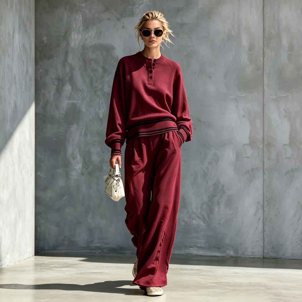 Burgundy button-neck top and wide-leg pants set with striped trim, worn by a model