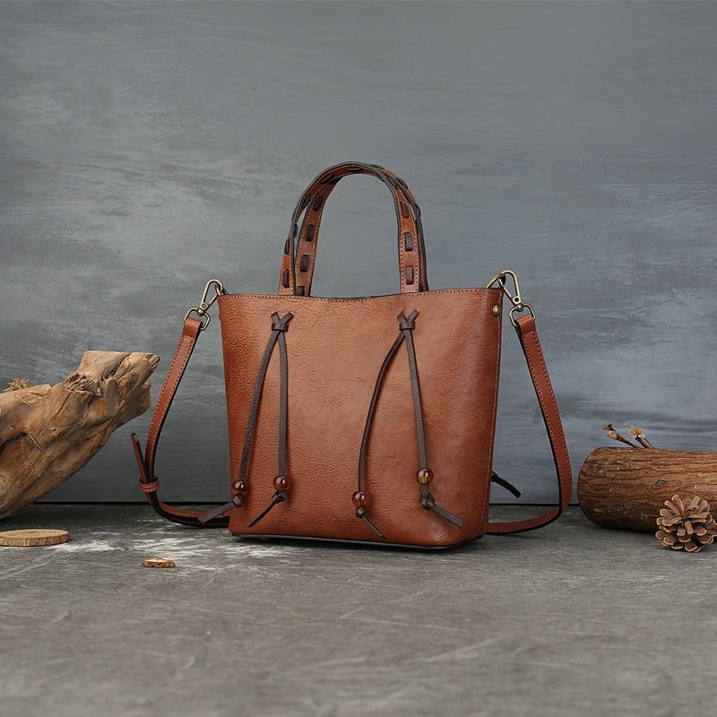 Woven Bucket Bag - PU Leather Minimalist Crossbody Bag for Women, shown in a clear product image