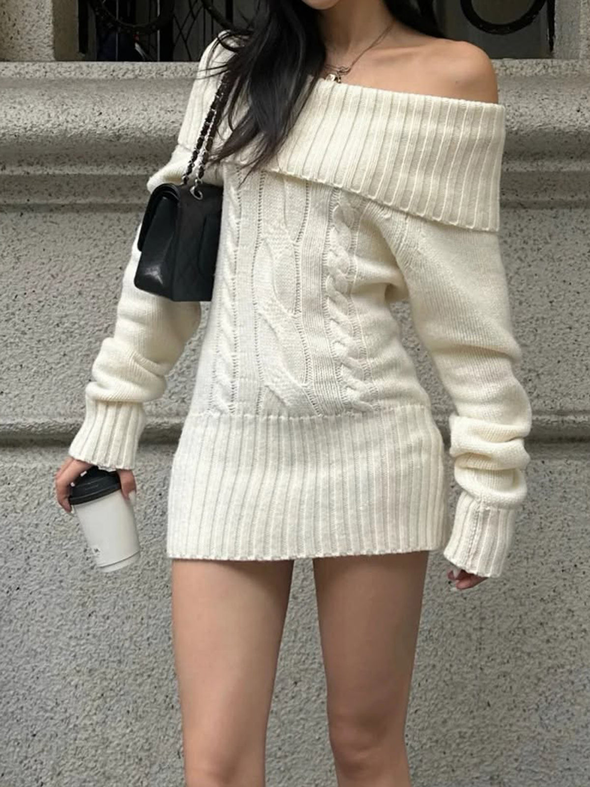 Cream off-shoulder mini sweater dress showing the cable-knit pattern