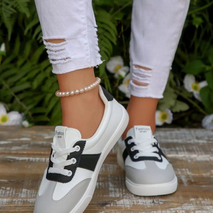 Round toe lace up sneakers in black and red — primary view