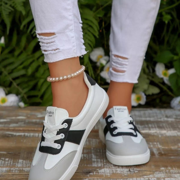 Round toe lace up sneakers in black and red — primary view
