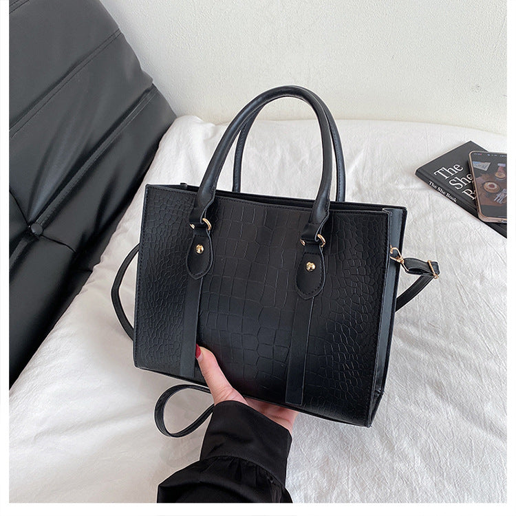 Shoulder tote bag shown carried crossbody