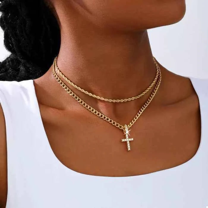 Layered gold chain cross pendant necklace — primary view