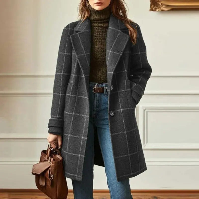 Charcoal windowpane-check coat with lapels and front pockets, worn by a model
