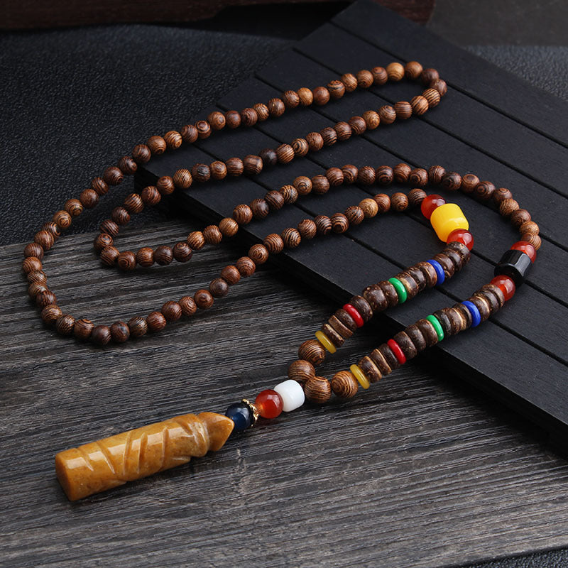 Brown beaded necklace with multicolor disc beads and long rectangular brown pendant