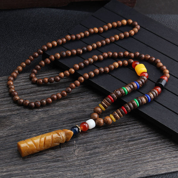 Brown beaded necklace with multicolor disc beads and long rectangular brown pendant