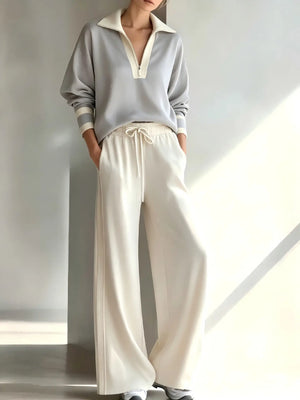 Gray long-sleeve top and cream wide-leg pants, full-length view on a model
