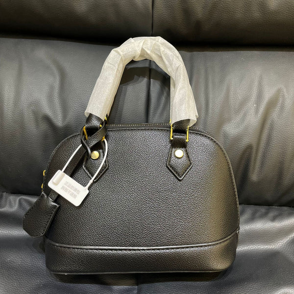Shell crossbody bag shown carried crossbody
