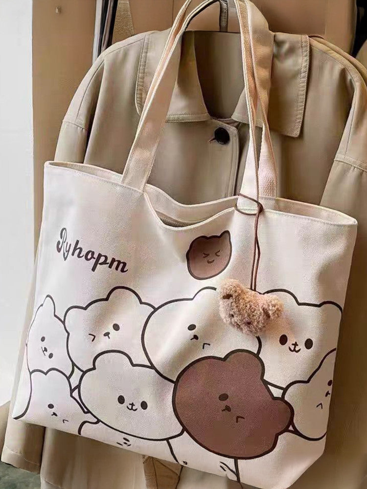 Bear print tote bag shown carried on shoulder