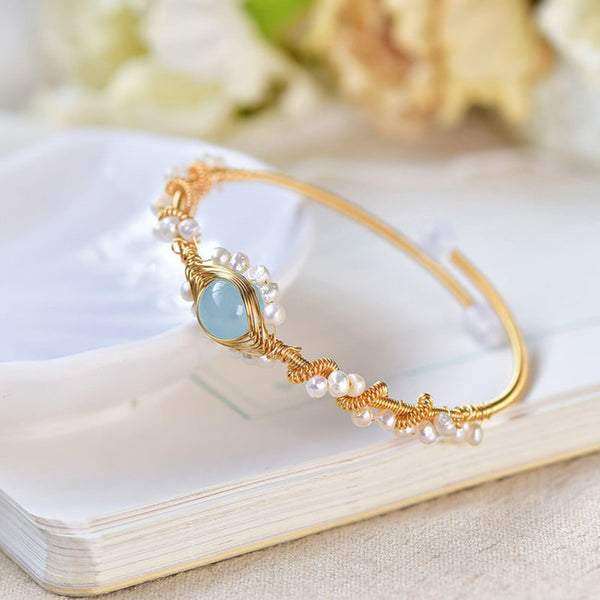 Product detail photo of Gold Tone Pearl Braided Bracelet, gold tone pearl braided bracelet
