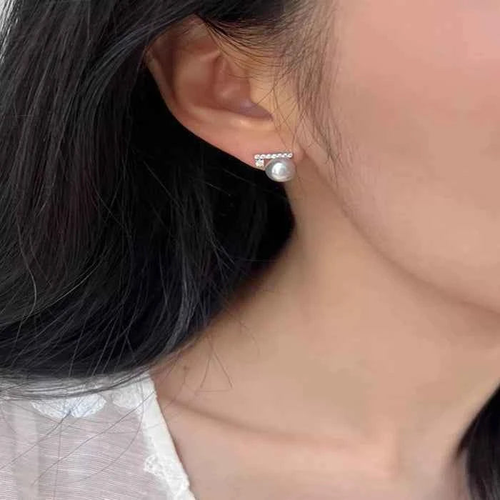 Pearl and zircon stud earrings in silver-plated alloy — primary view