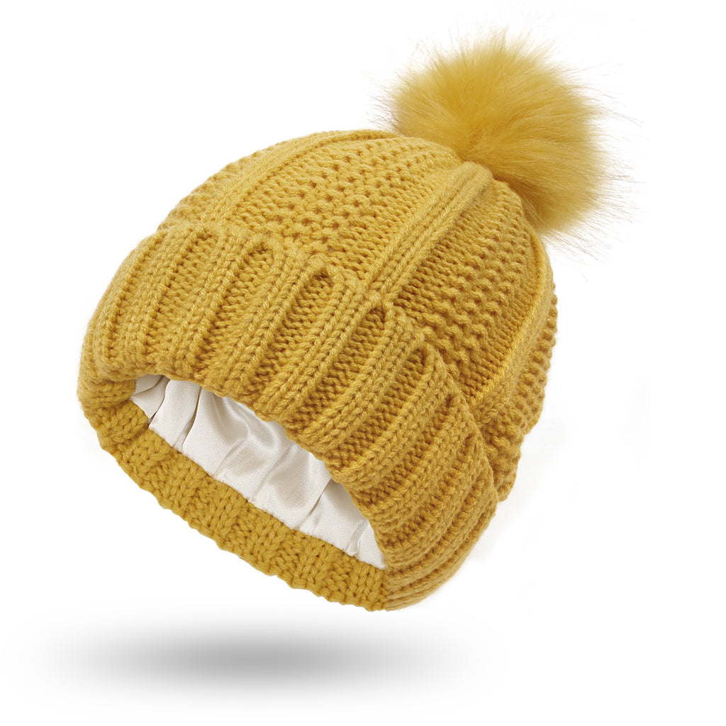 Yellow satin lined pom pom beanie hat for women