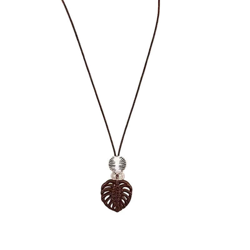 Long necklace with a textured brown heart pendant and silver-tone accent bead