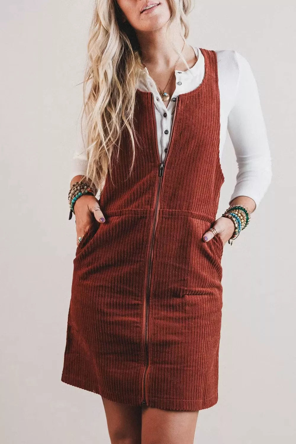 Model wearing the Ribbed Corduroy Zip-Up Sleeveless Pocket Sheath Dress