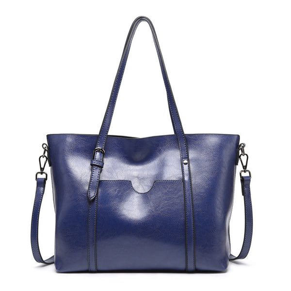 Retro tote bag shown carried on shoulder