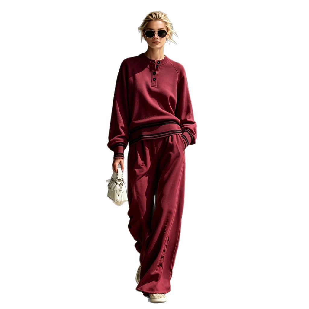 Burgundy button-neck top and wide-leg pants set on a white background