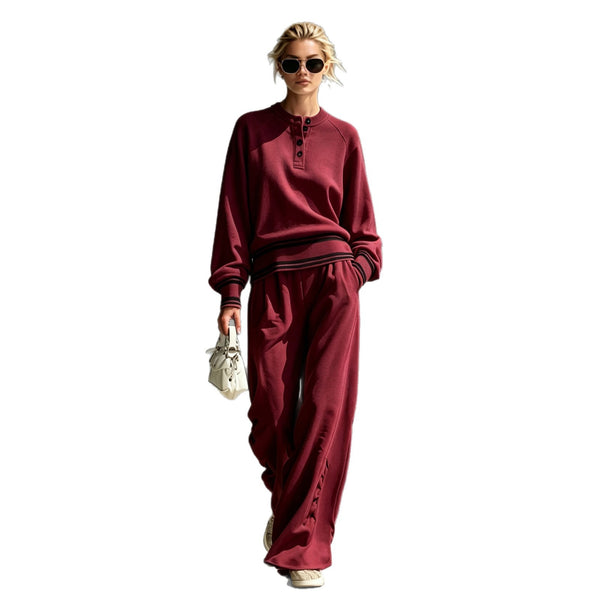 Burgundy button-neck top and wide-leg pants set on a white background