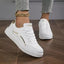 Round toe lace up sneakers in gold and white — primary view