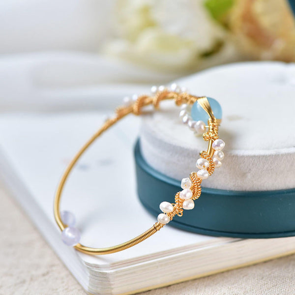 Product detail photo of Gold Tone Pearl Braided Bracelet, gold tone pearl braided bracelet