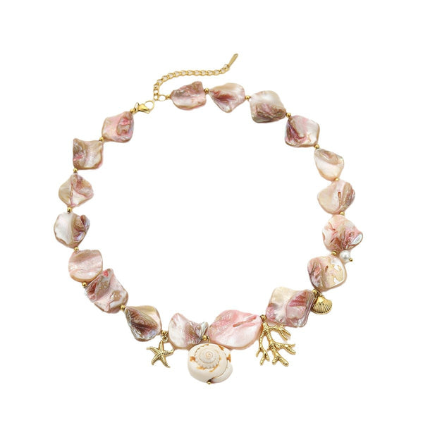 Pink shell-style necklace with gold-tone chain and marine charms on white