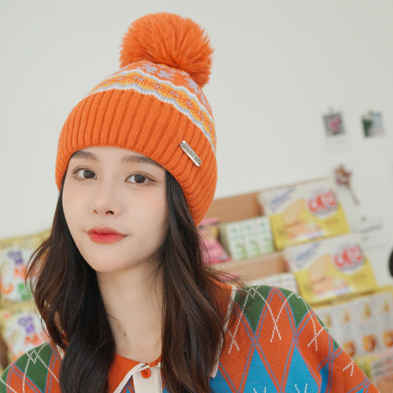 Orange pom pom knit beanie with ear flaps for women