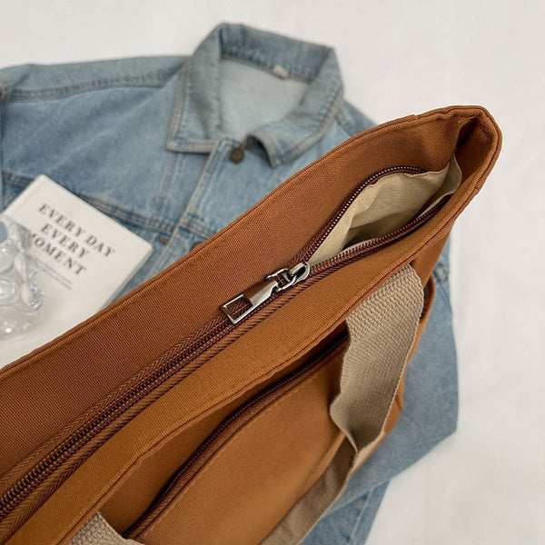 Canvas tote bag zip-up closure detail