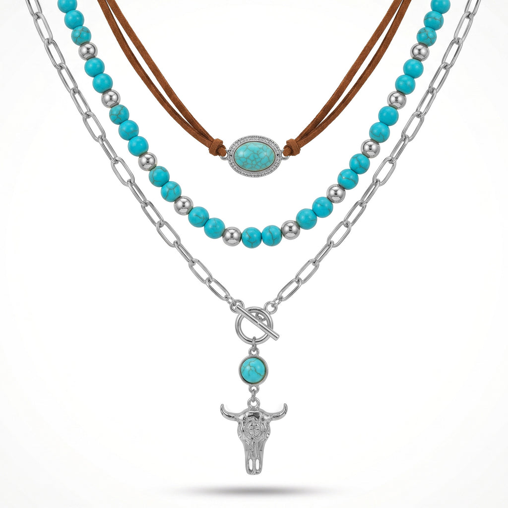 Layered necklace with turquoise-colored beads, brown cord and a silver-tone bull head pendant