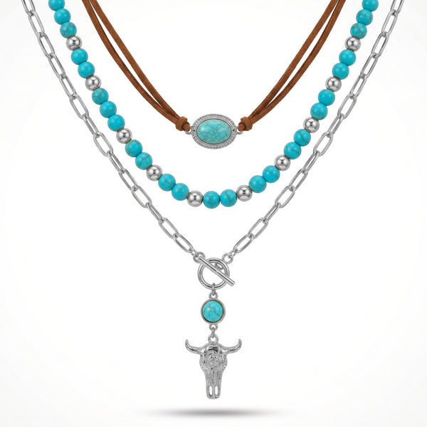 Layered necklace with turquoise-colored beads, brown cord and a silver-tone bull head pendant
