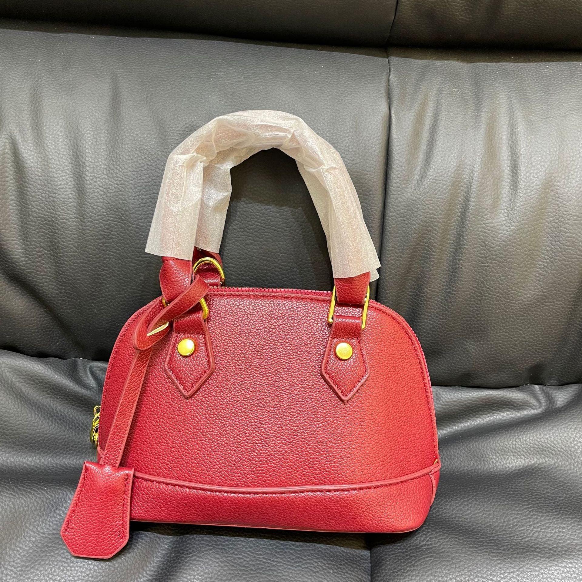 Shell crossbody bag hardware detail