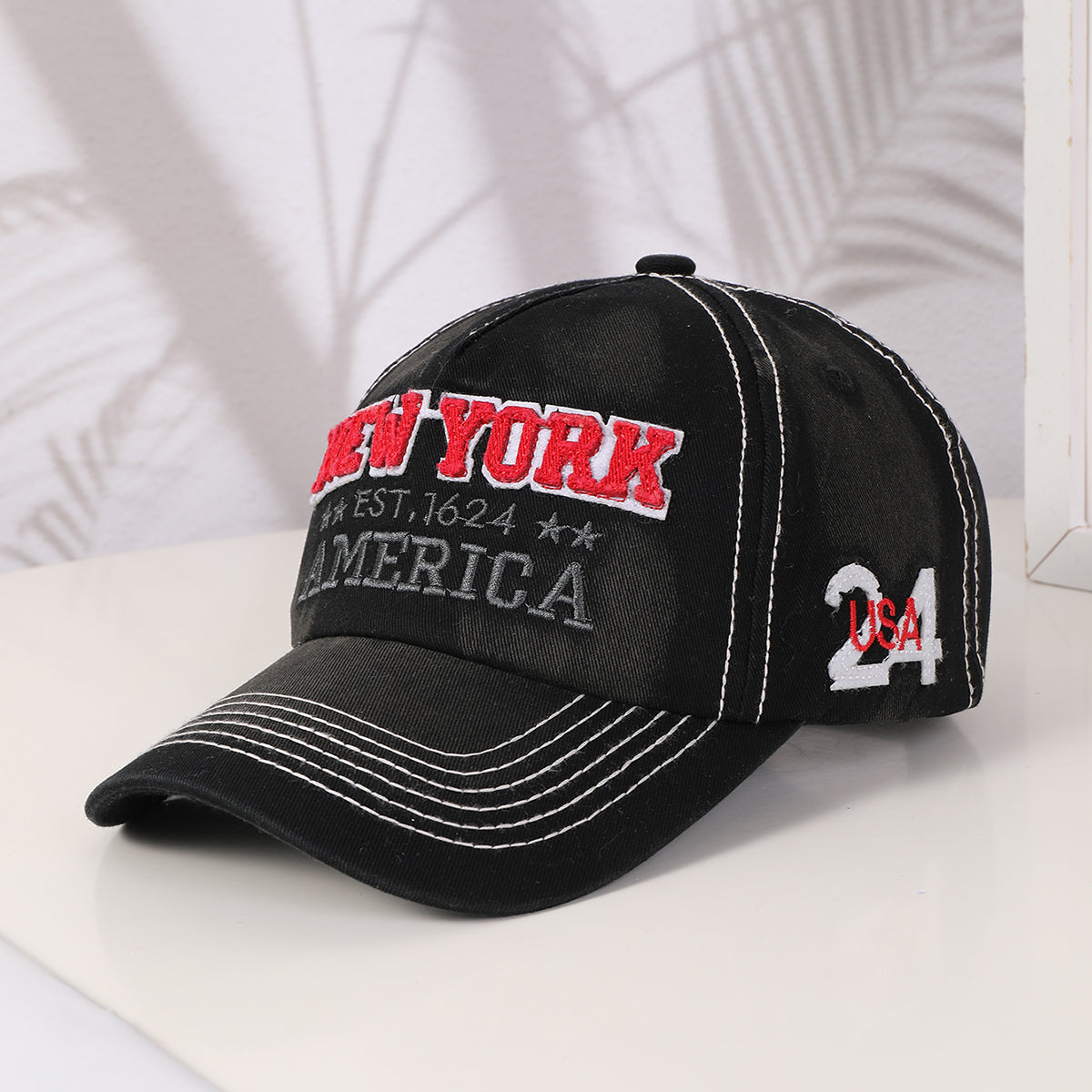 Black embroidered lettering baseball cap
