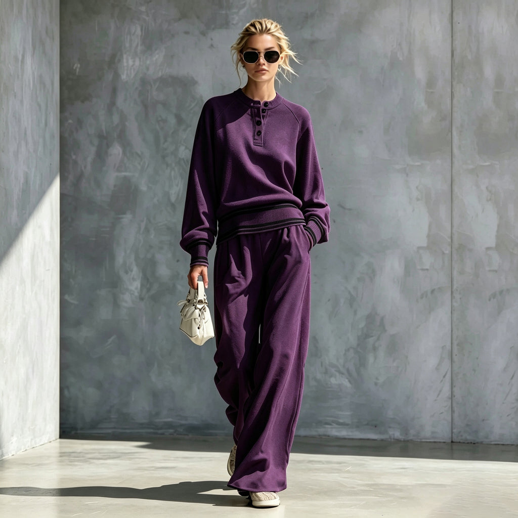 Purple button-neck top and wide-leg pants set with striped trim, worn by a model