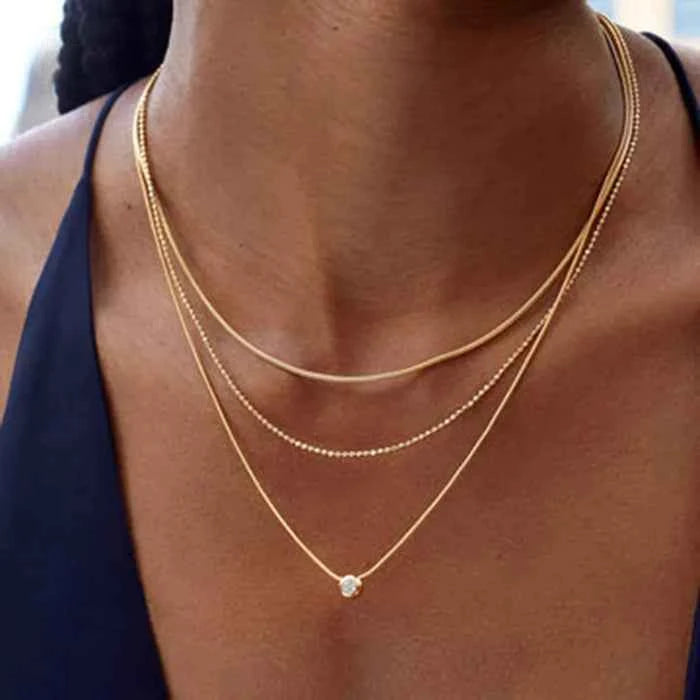 Triple chain layered necklace in 18K gold-plated finish — primary view
